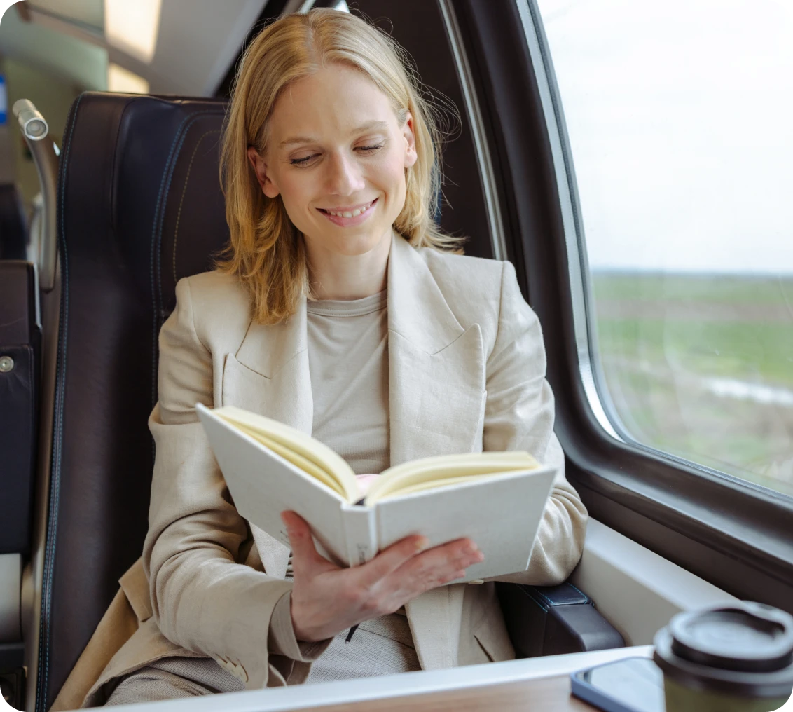 Passenger enjoying book during train journey